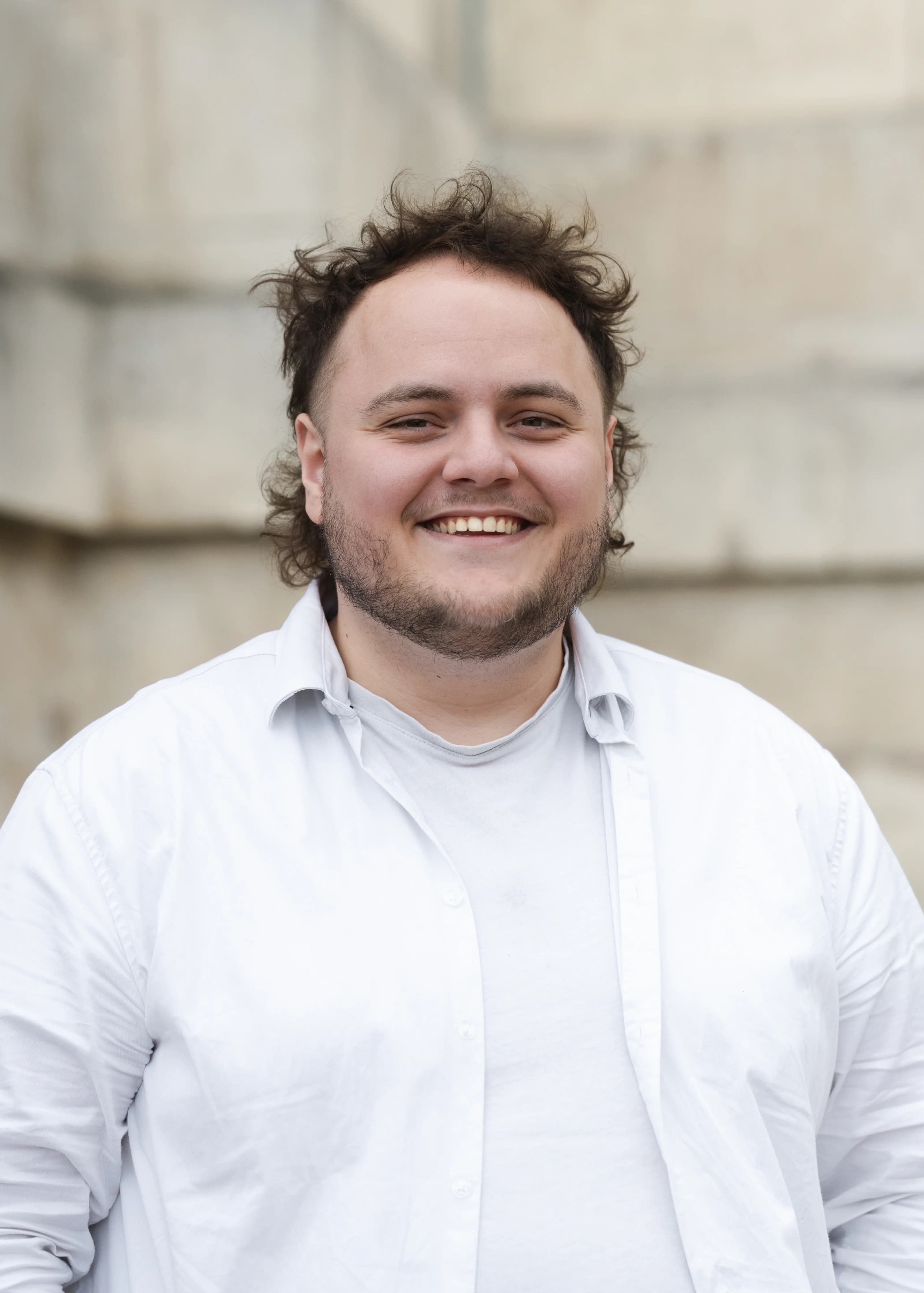 Portrait of Jonathan Blanchard smiling outdoors